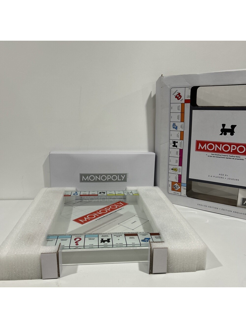 MONOPOLY Glass Edition Deluxe Board Game – Tempered Clear Series